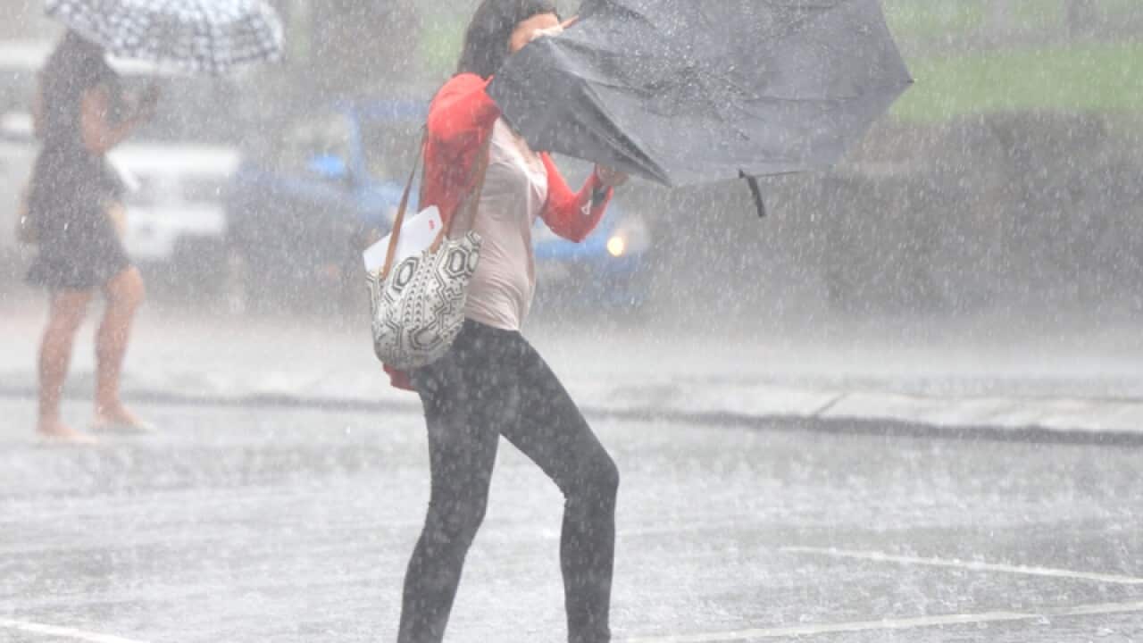 Pedestrians rush across the road
