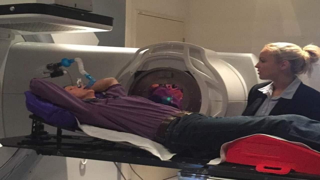 A file image of former nurse Sue Hewlett receiving radiation therapy.