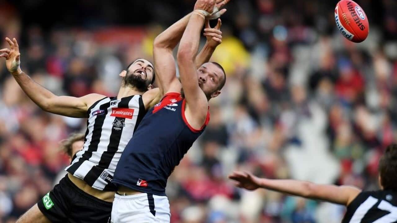 Max Gawn of the Demons and Brodie Grundy of the Magpies