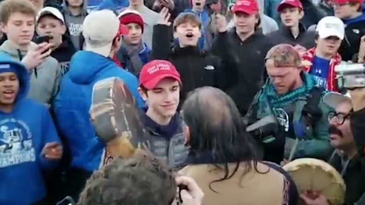 US students mock a Native American man at the Washington Indigenous rally