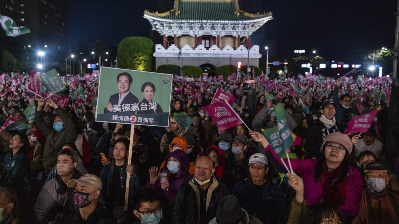 Supporters of Taiwan Democratic Progressive Party (DPP) presidential candidate William Lai cheer during a rally in Taipei, Taiwan (AAP)