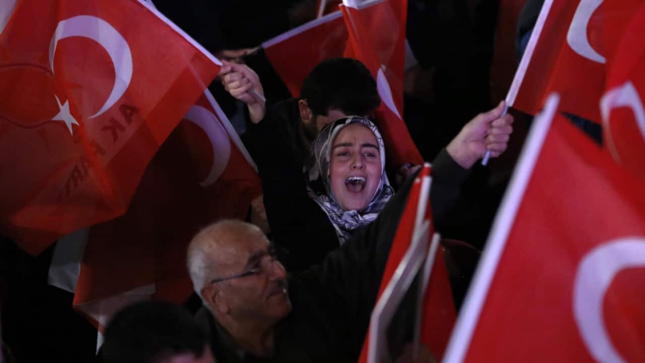 Supporters of Turkish President Erdogan celebrate as preliminary results of the constitutional referendum are announced in Ankara, Turkey