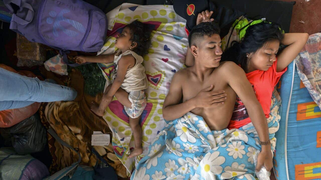 A family rests at a shelter in Mocoa, Putumayo department, southern Colombia on April 3, 2017.Residents of Mocoa were Monday desperately searching for loved ones missing since devastating mudslides slammed into the remote Colombian town, as the death toll