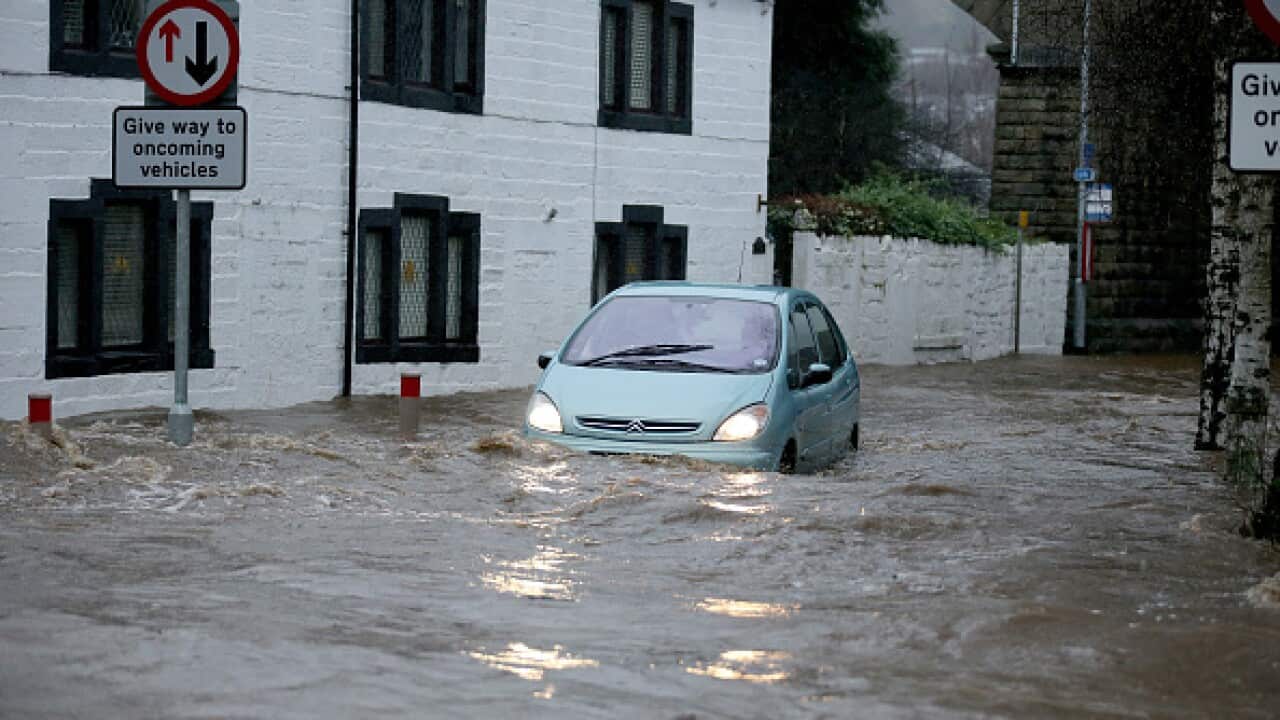 The River Calder bursts its bank's in the Calder Valley town of Mytholmroyd on December 26, 2015 iMytholmroyd, England. (AAP)