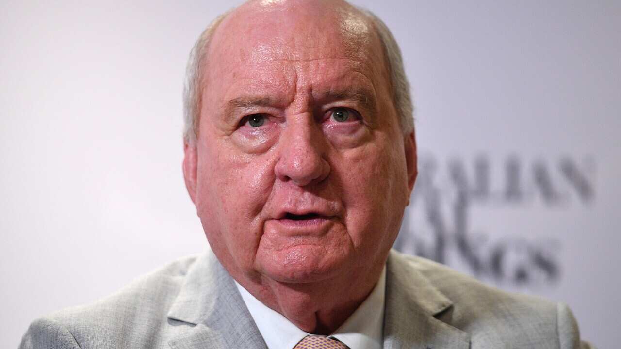 A man wearing a suit and tie