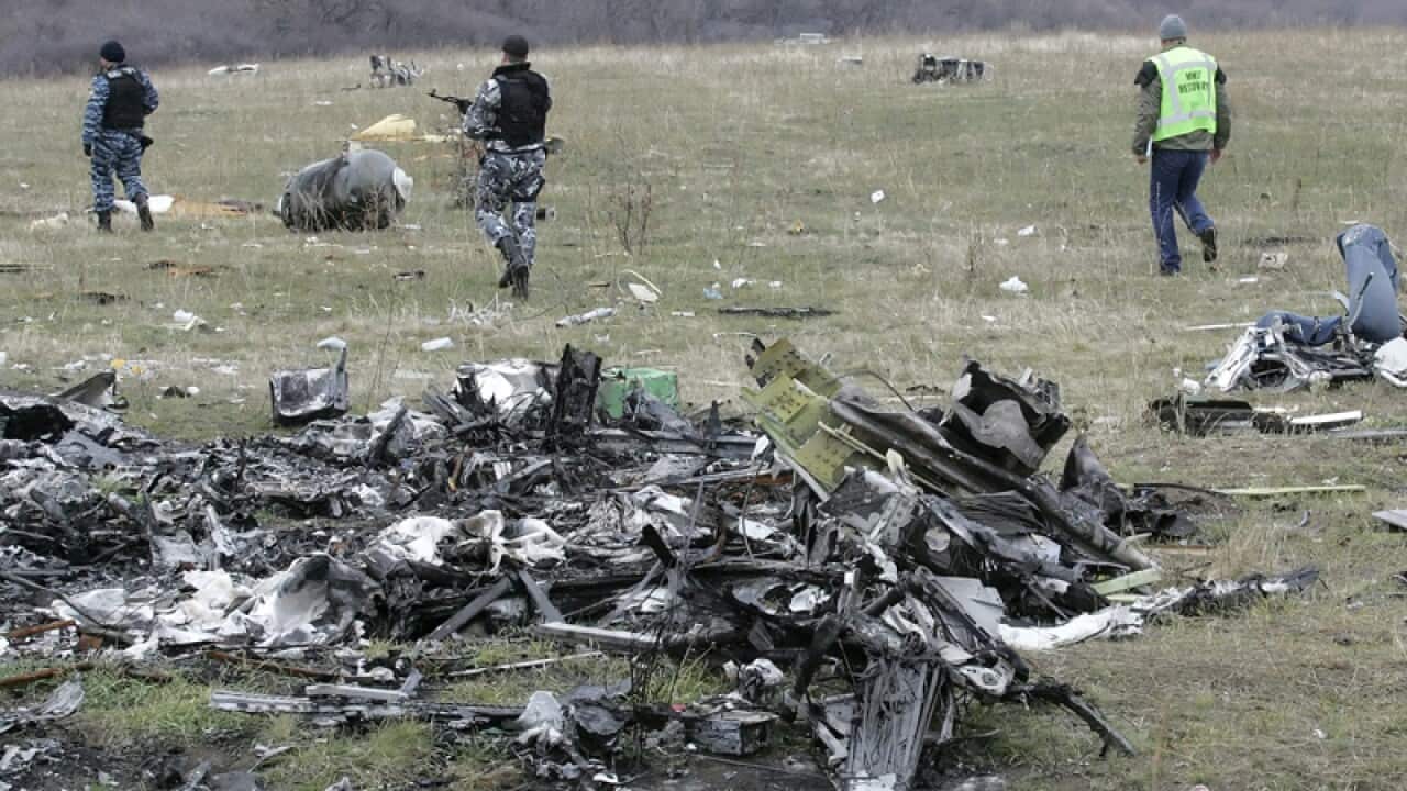Investigators at the MH17 crash site.