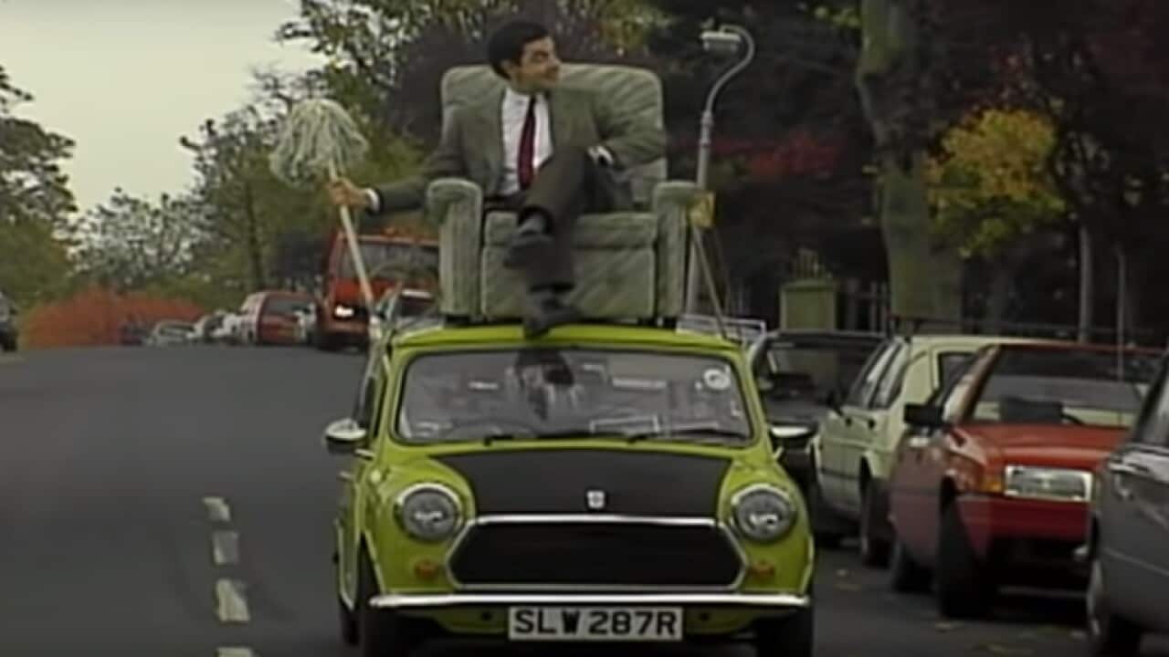 Mr Bean driving on top of car