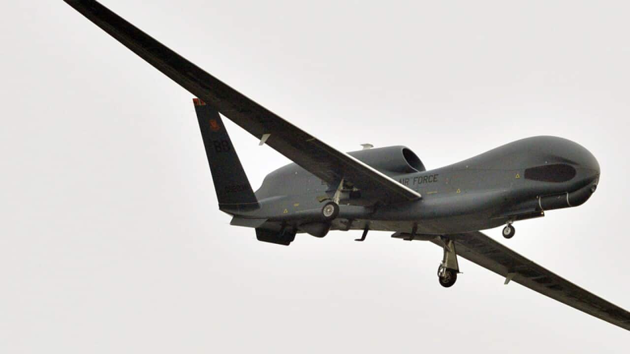 A U.S. Global Hawk surveillance drone prepares to land