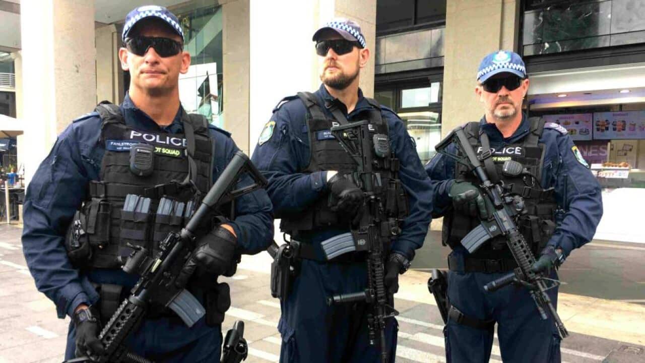 Police holding the new Colt M4 Carbine rifles
