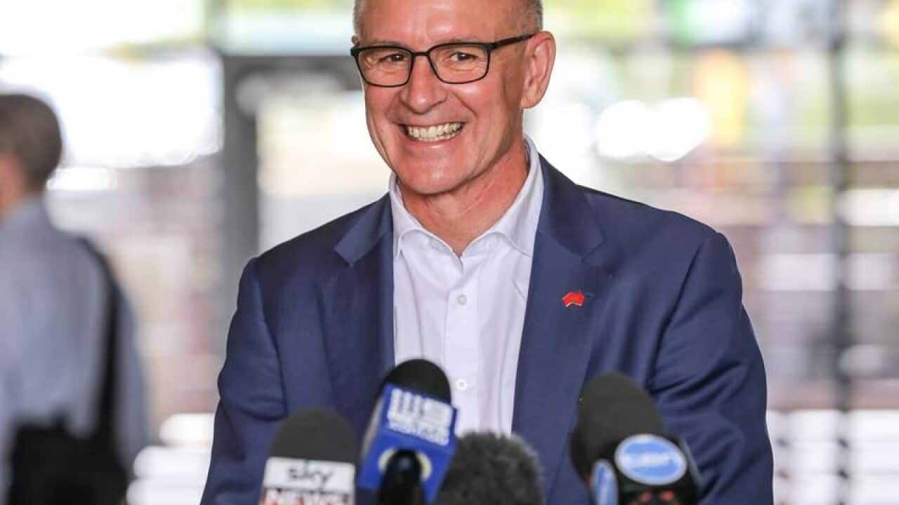 SA premier Jay Weatherill smiles while speaking to media.