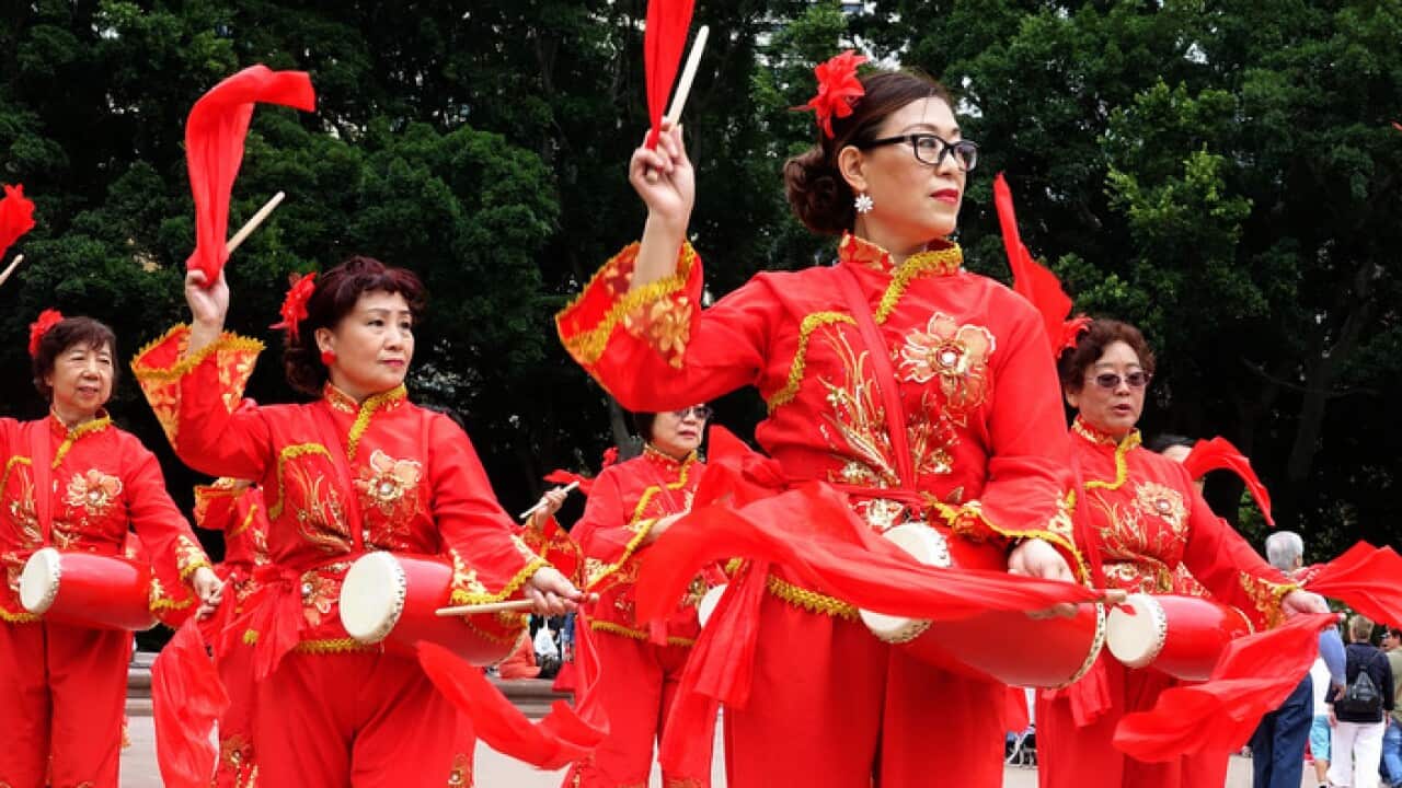 Asian Women at Work drumming group perform part in the Sydney International Women's Day March 'Stop the Silence! End the Violence!' in Sydney, Saturday, March 10, 2018. (AAP Image/Ben Rushton) NO ARCHIVING