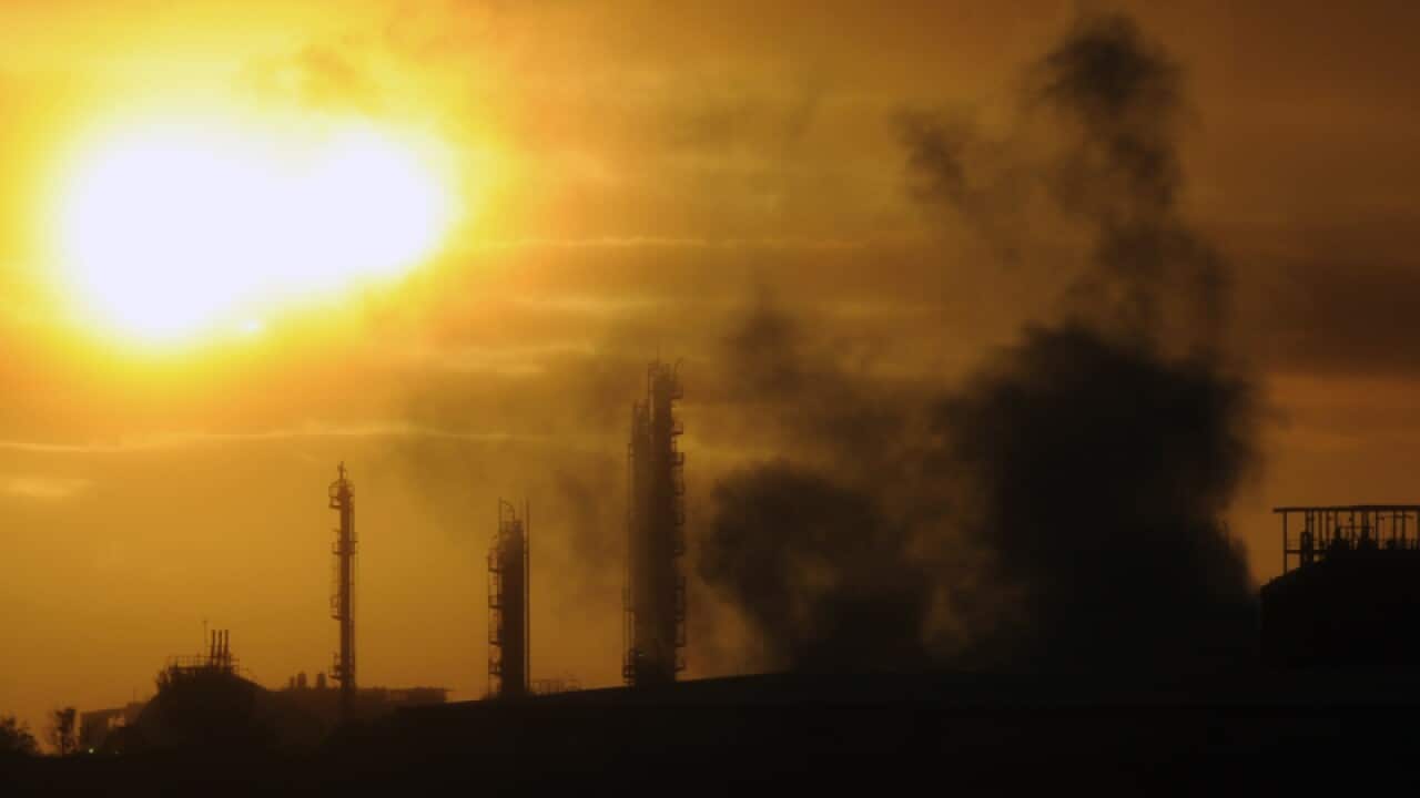 Steam and other emissions rise from an industrial plant in Melbourne