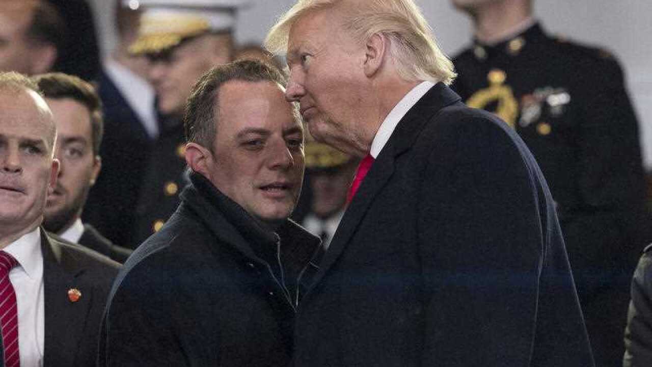 President Donald Trump speaks with his Chief of Staff Reince Priebus