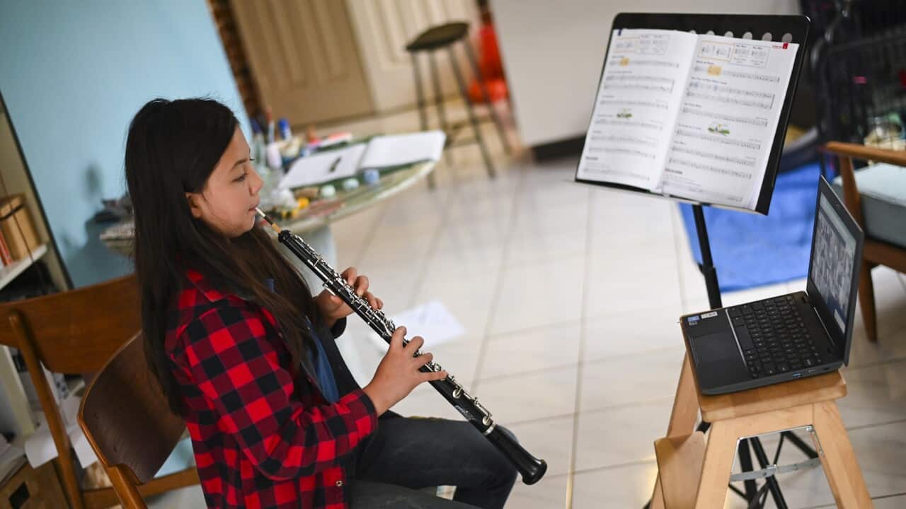 10 year old student Mila plays the oboe during an online lesson