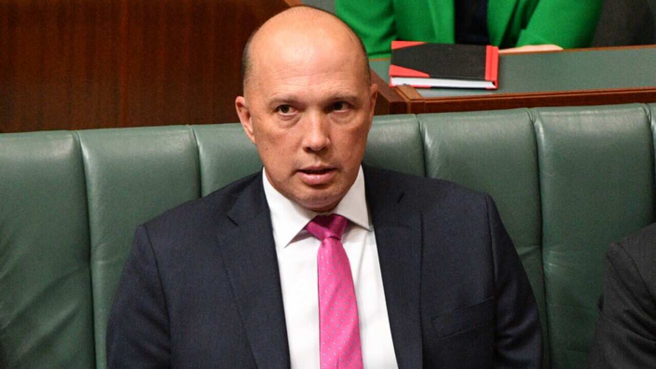 Minister for Home Affairs Peter Dutton during Question Time in the House of Representatives at Parliament House in Canberra, Wednesday, September 12, 2018. (AAP Image/Mick Tsikas) NO ARCHIVING