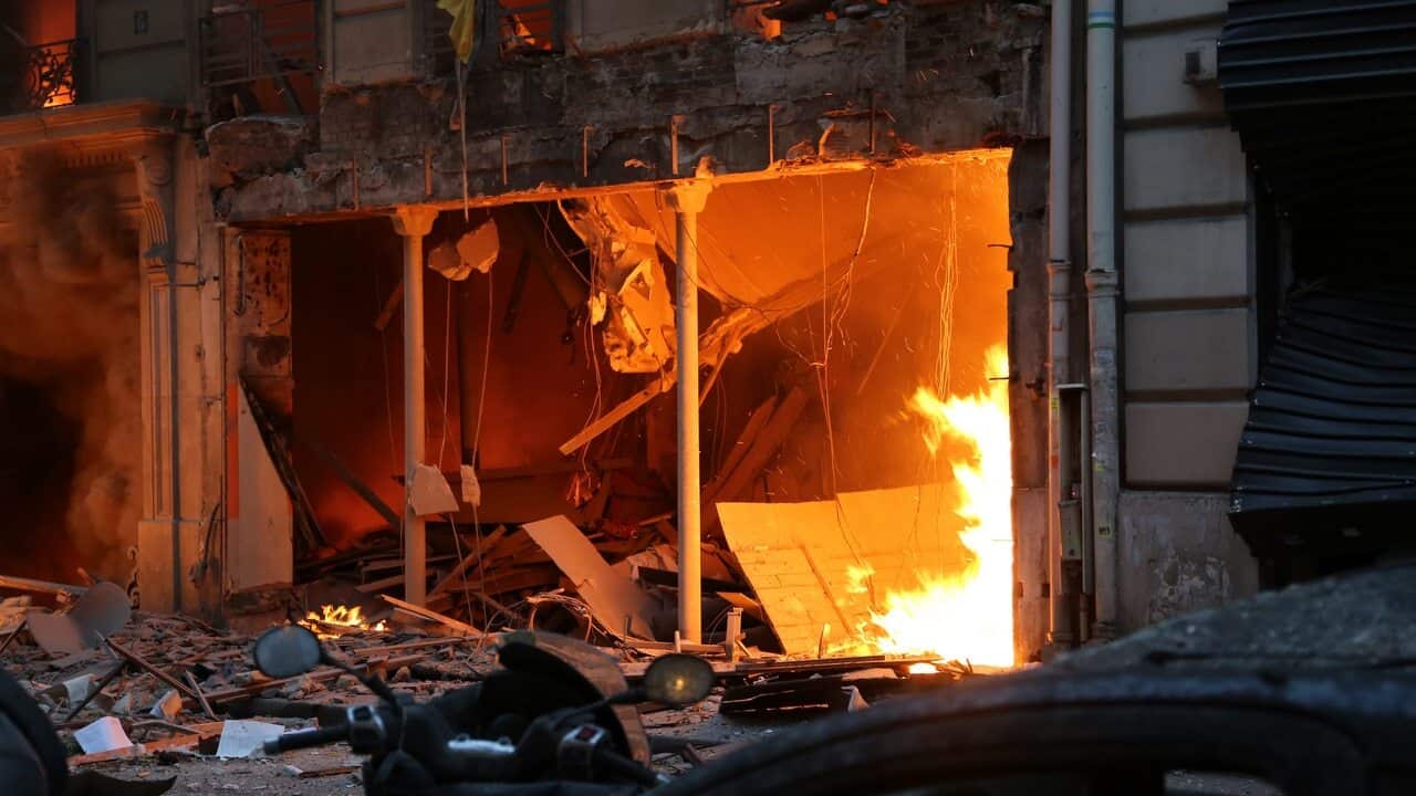 Flames are seen after an explosion of a bakery on the corner of the streets Saint-Cecile and Rue de Trevise in central Paris.