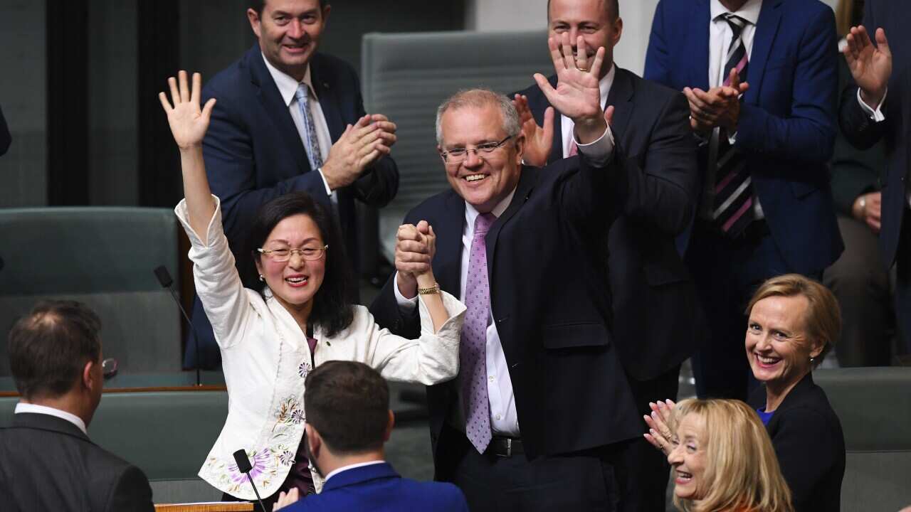 Gladys Liu is congratulated by Prime Minister Scott Morrison after delivering her maiden speech.