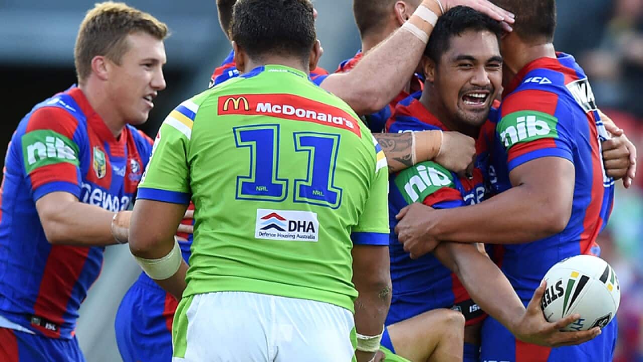 Pat Mata'utia of the Knights celebrates after scoring a try