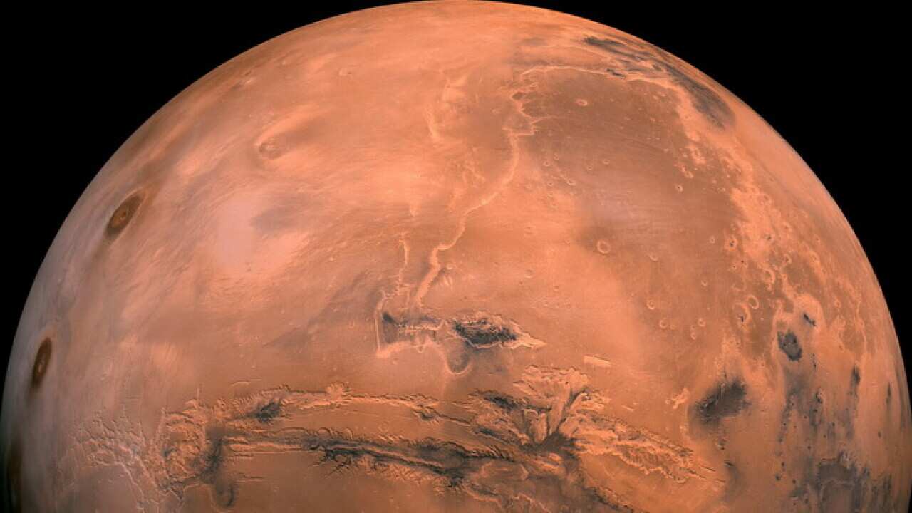 Scientists, using a satellite, discovered the large reservoir beneath layers of dust and ice near the south pole of Mars