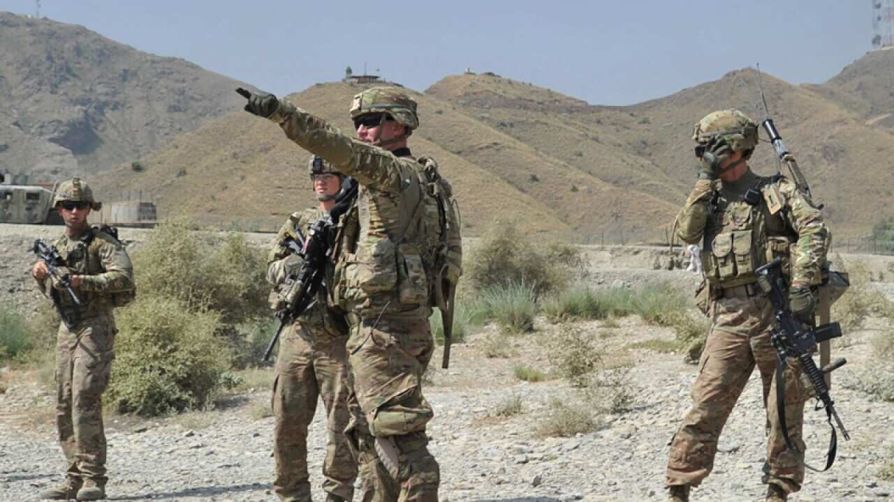 Soldiers following a clash between the Taliban and security forces