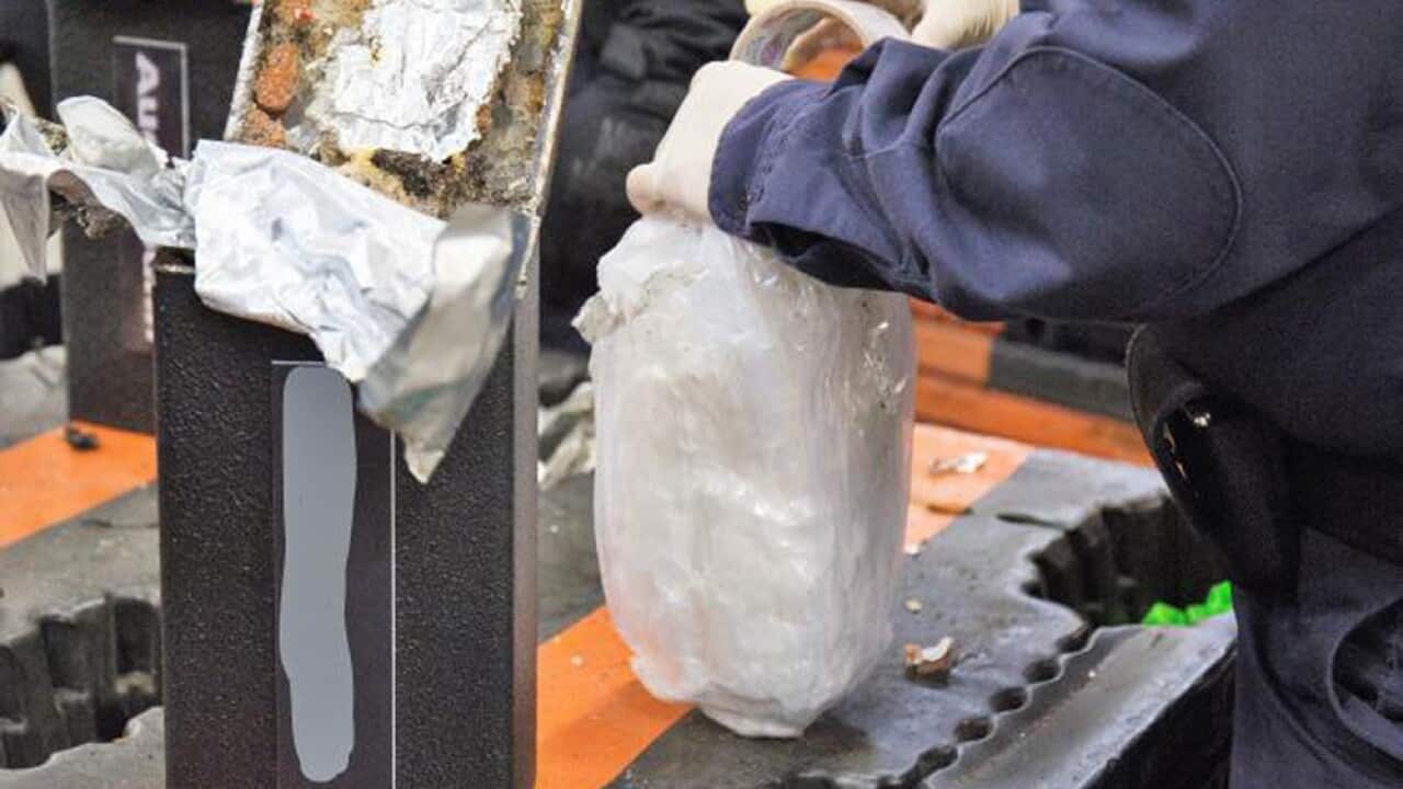This file photo shows a U.S. Customs and Border Protection officer extracting methamphetamine from a loudspeaker.
