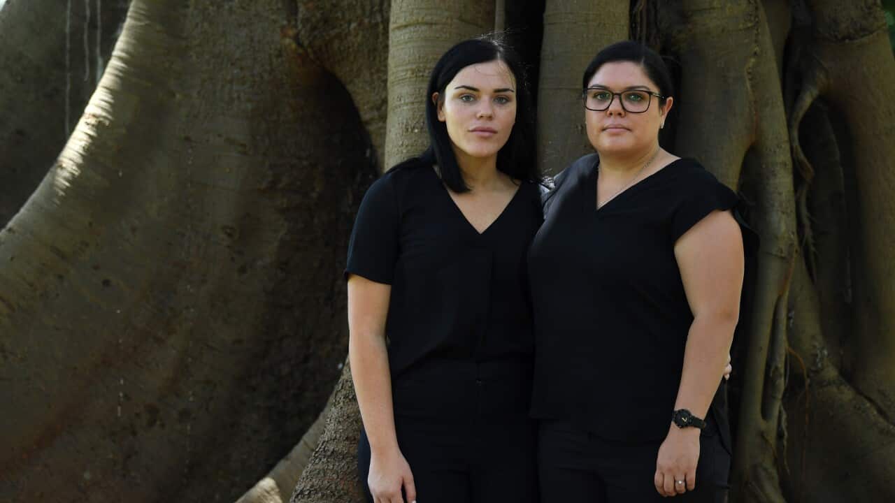 Makayla (left) and Taleah Reynolds, sisters of Nathan Reynolds during a Black Lives Matter rally in Sydney on Monday.