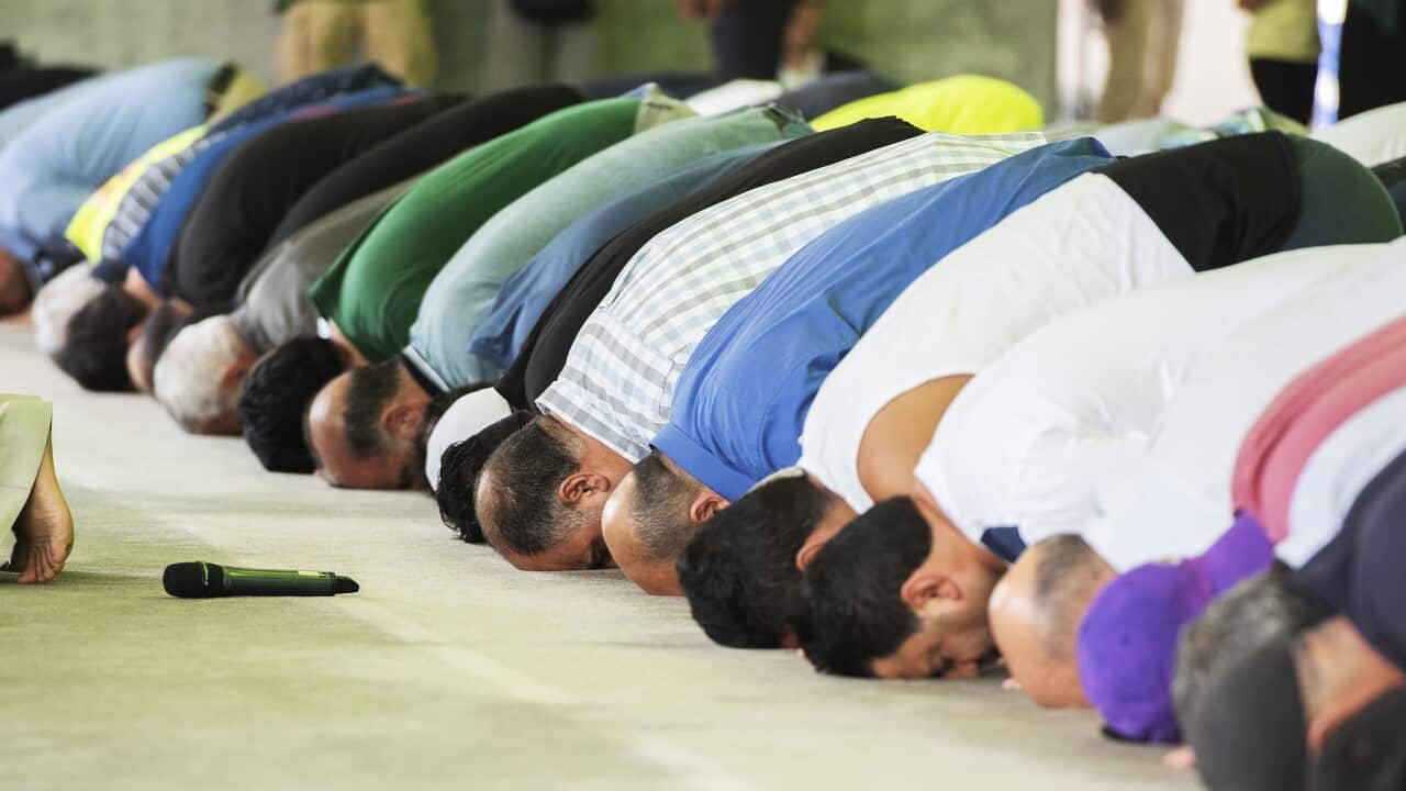 Men pray during the call to prayer at the open day of the Australian Islamic Centre in Newport. Melbourne.