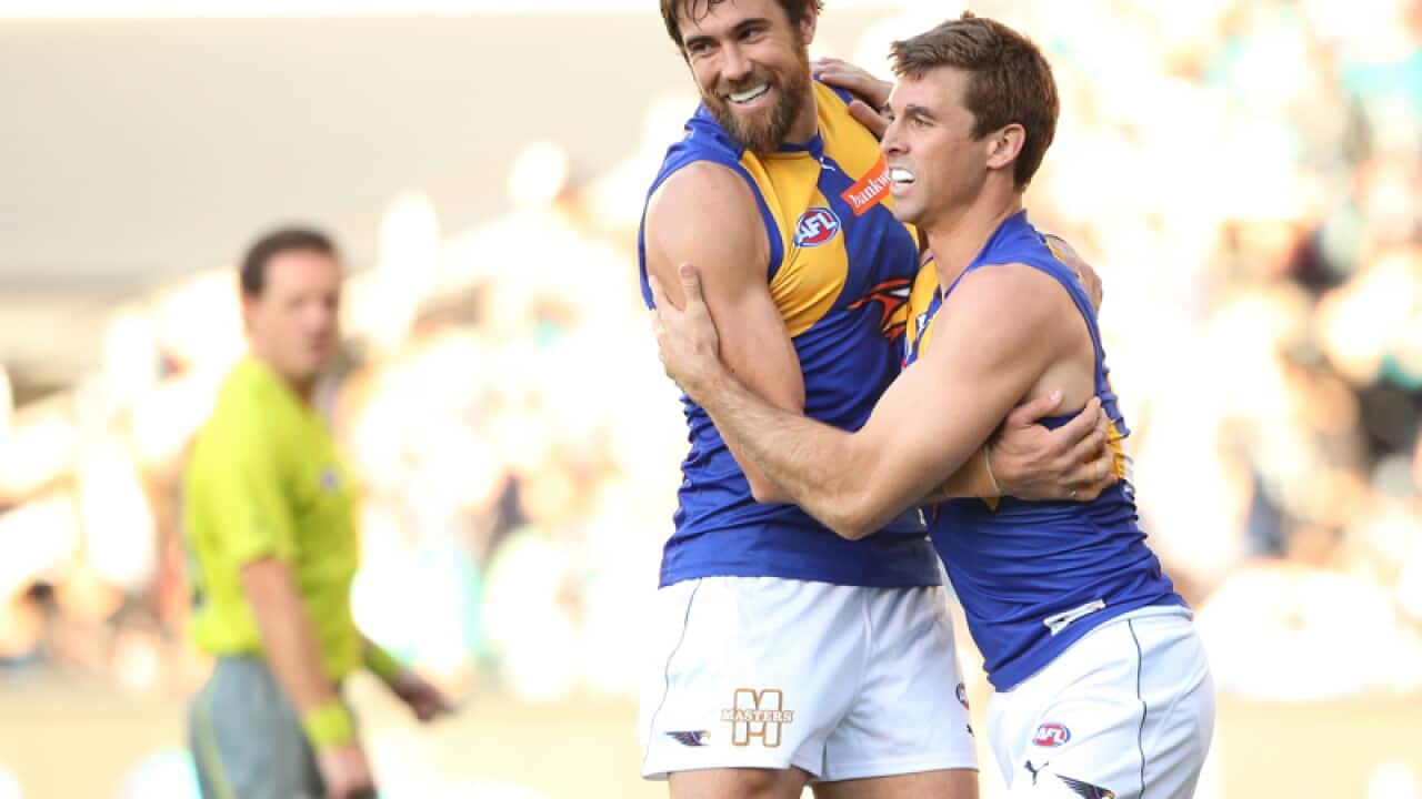 Jamie Cripps of the Eagles is congratulated by Josh Kennedy