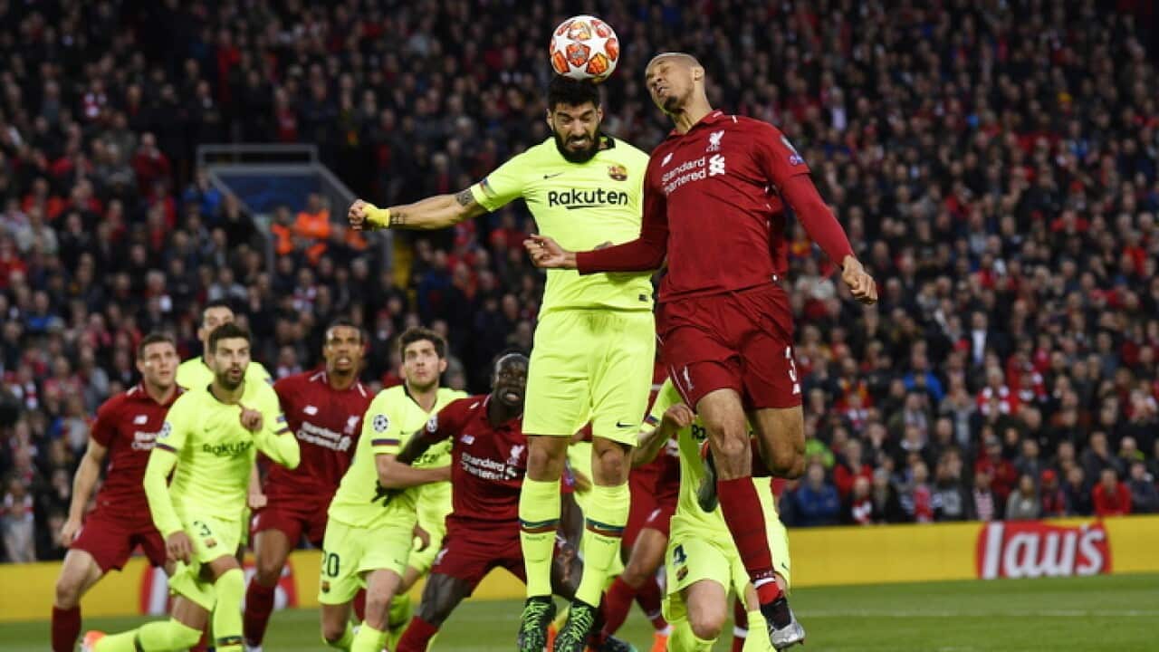 Luis Suarez (L) of Barcelona and Fabinho of Liverpool go for a header during the UEFA Champions League semi final 2nd leg match between Liverpool FC and FC Barcelona at Anfield, Liverpool, Britain, 07 May 2019. EPA/NEIL HALL