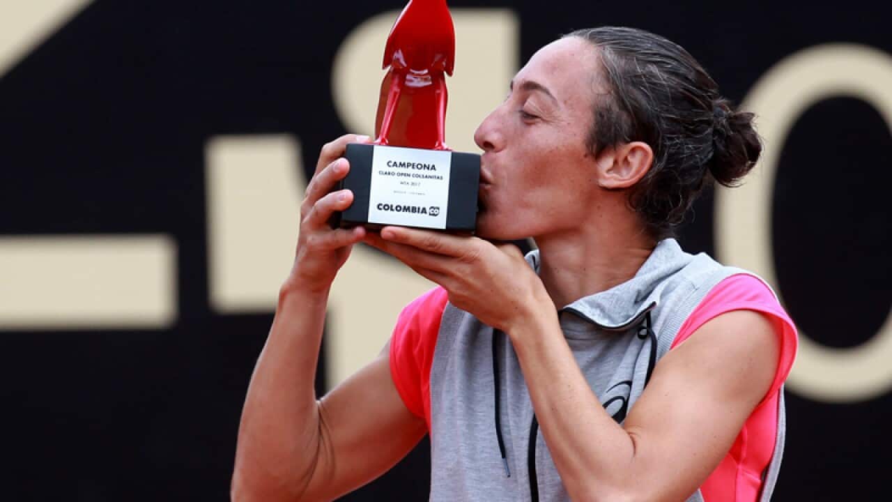 Francesca Schiavone, of Italy, kisses the trophy after winning