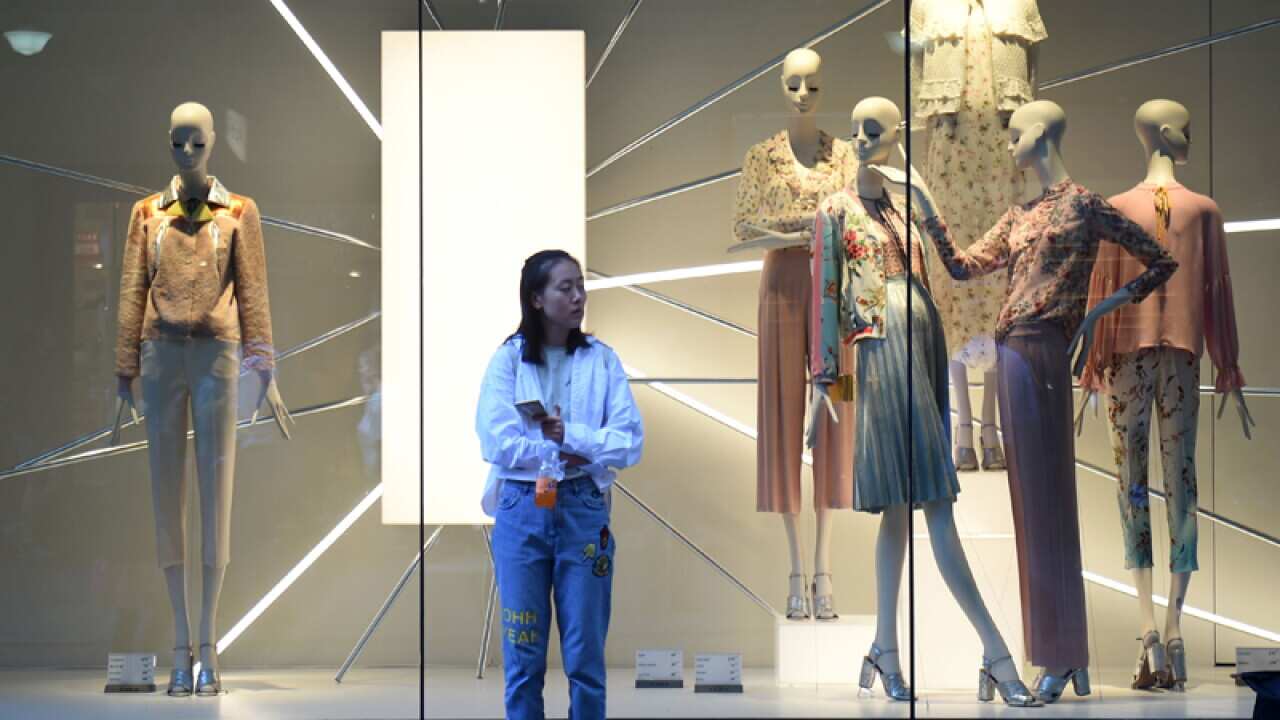 A pedestrian outside a department store