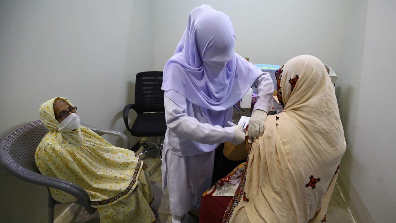 A Pakistani citizen receives a dose of the AstraZeneca vaccine against Covid-19after the country received its first shipment through the Covax program