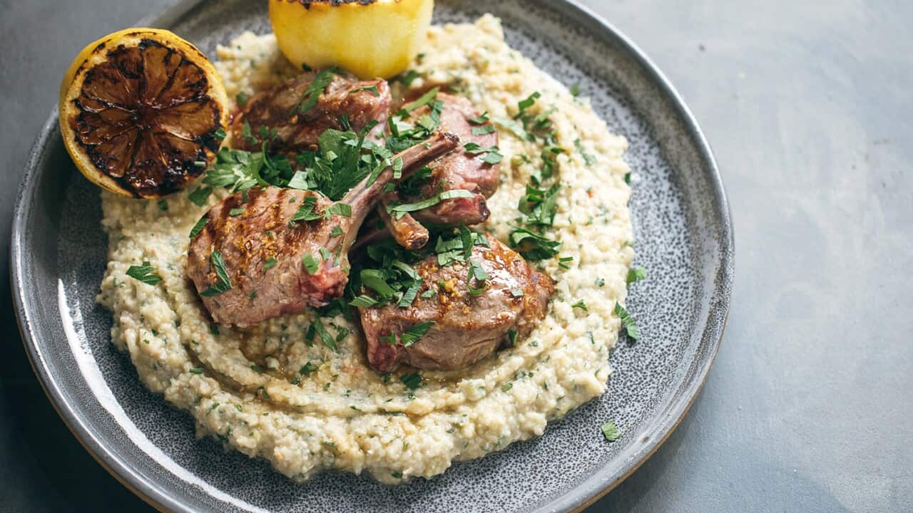 Lamb lollipoops with white bean and artichoke dip