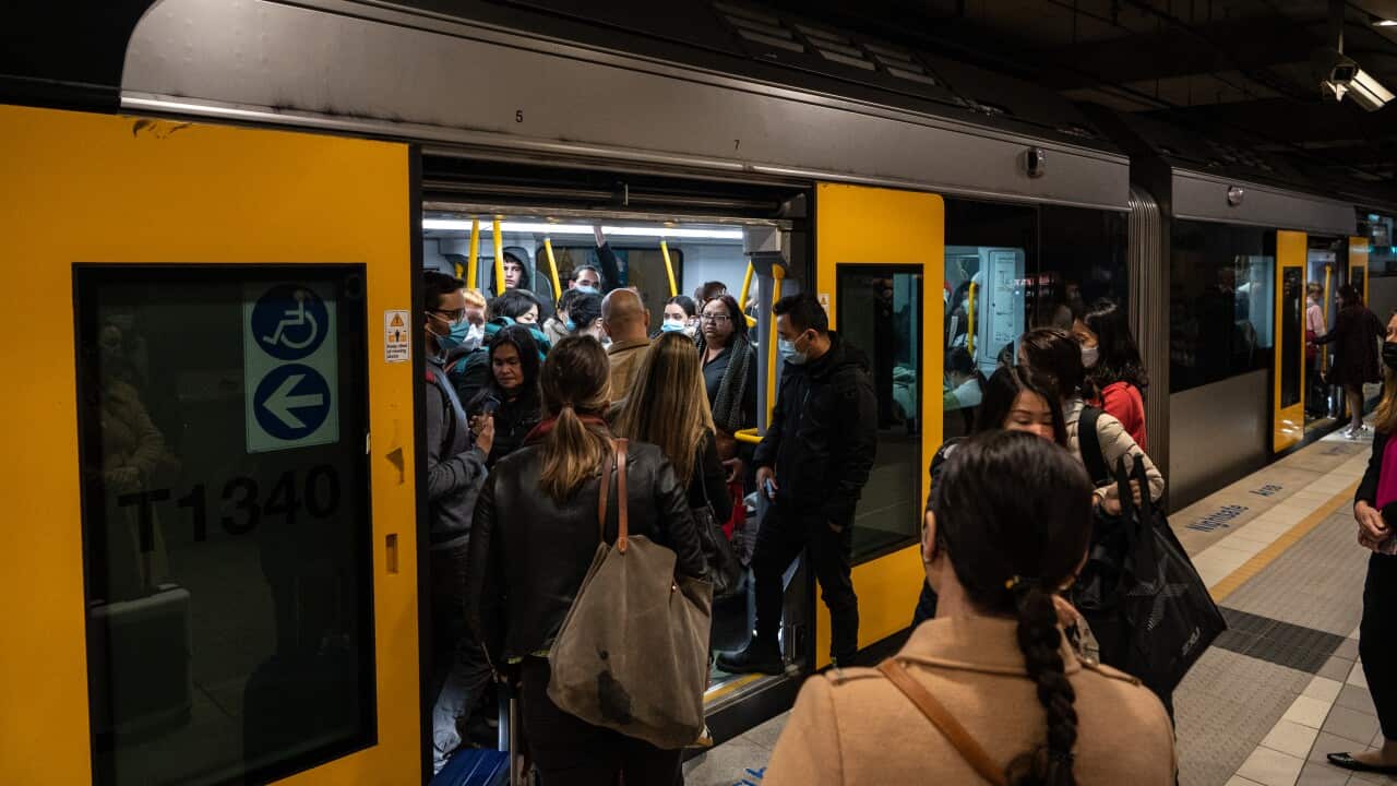 Commuters are seen at T8 Airport train station in Sydney, Wednesday, August 17, 2022.