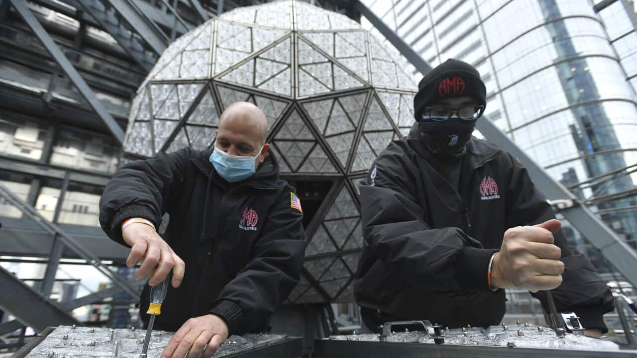 Workers install Waterford Crystal triangles on the Times Square New Year's Eve Ball.