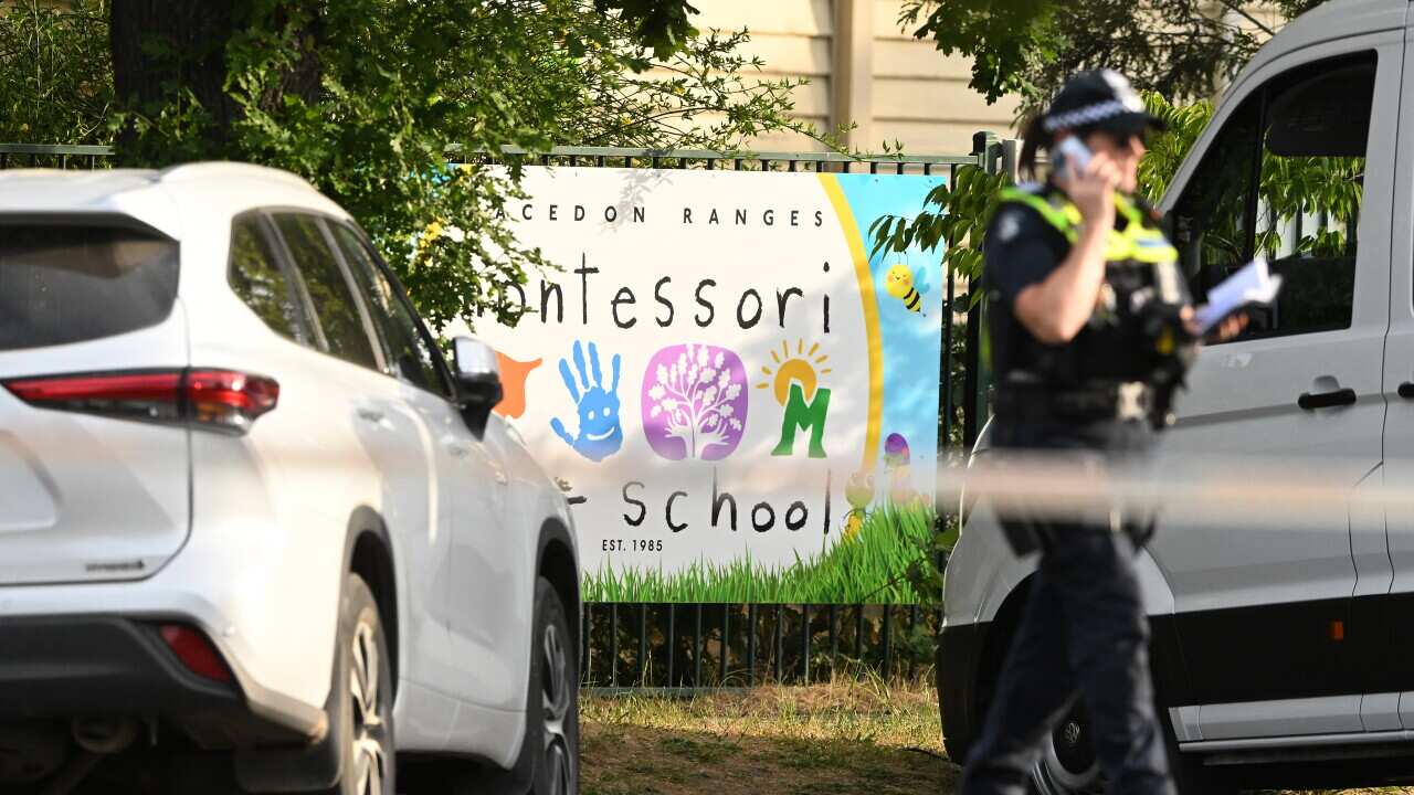 A police officer standing at a the scene of an accident