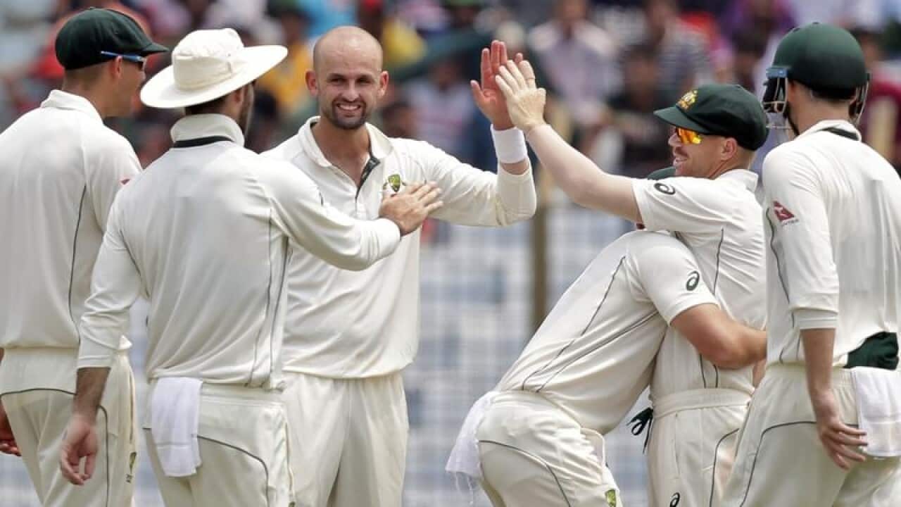 Australia's Nathan Lyon, center, celebrates with his teammates.