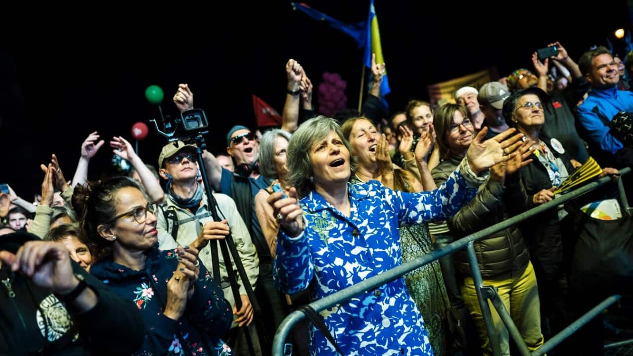 A woman dances during performance of German musician Herbert Groenemeyer during at the demonstration '#indivisible - solidarity