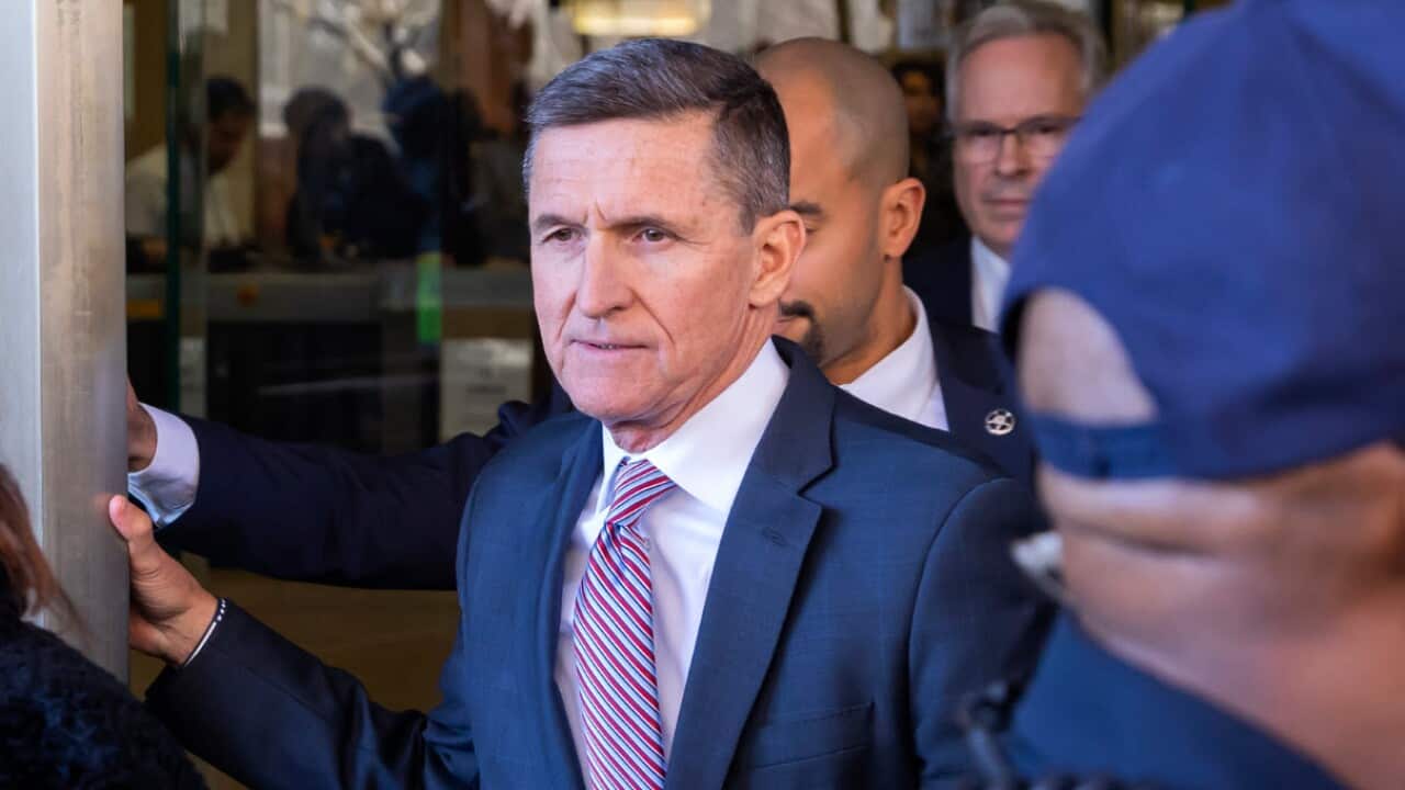 Former national security advisor Michael Flynn leaves court after a sentencing hearing