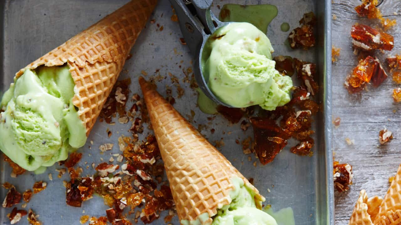 Pandan ice-cream with toffee pecans in a waffle cone