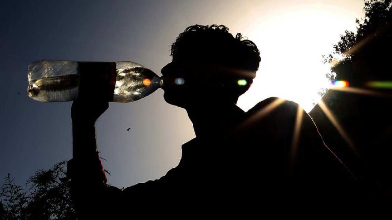 Boy drinking water from bottle