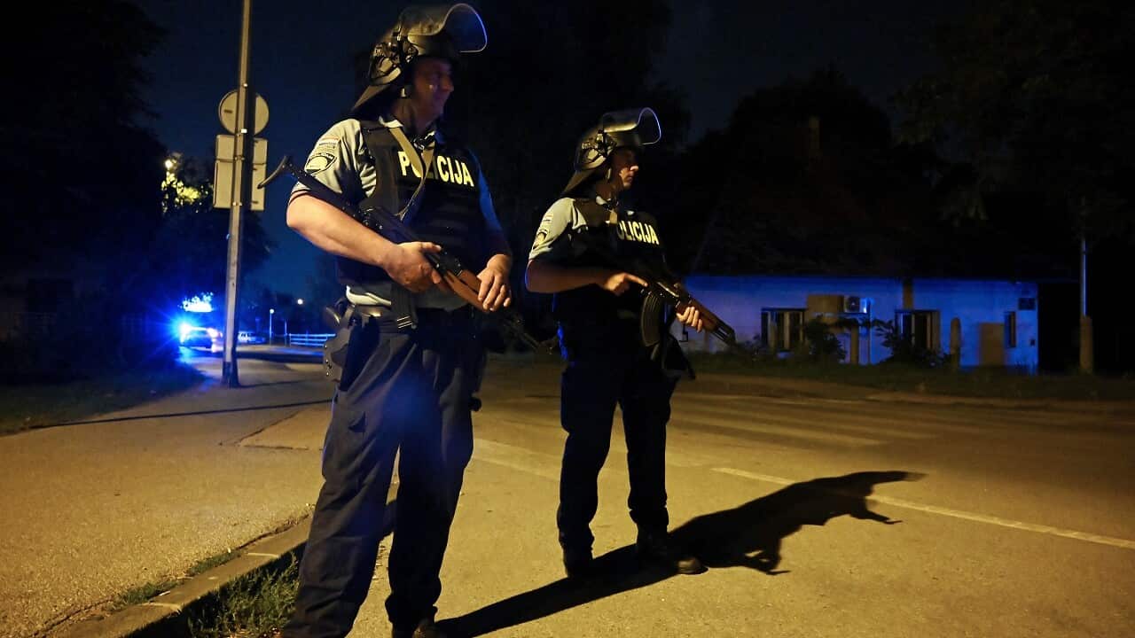 Police officers at the scene of the shooting.
