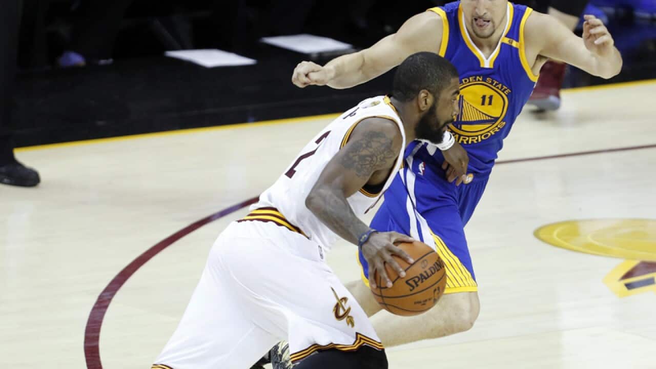 Cleveland Cavaliers guard Kyrie Irving (L)Klay Thompson (R)