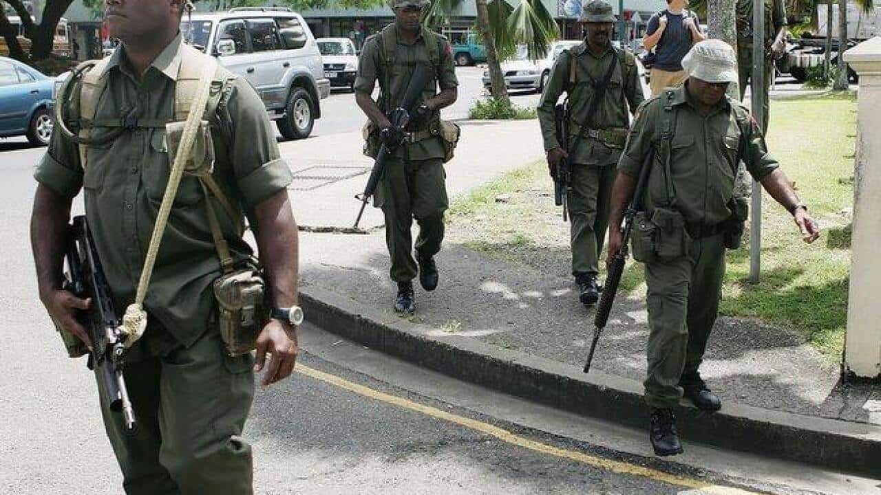 8682_soldiers-patrol-the-streets-of-suva-on-december-8--2006-b--getty_1464430445