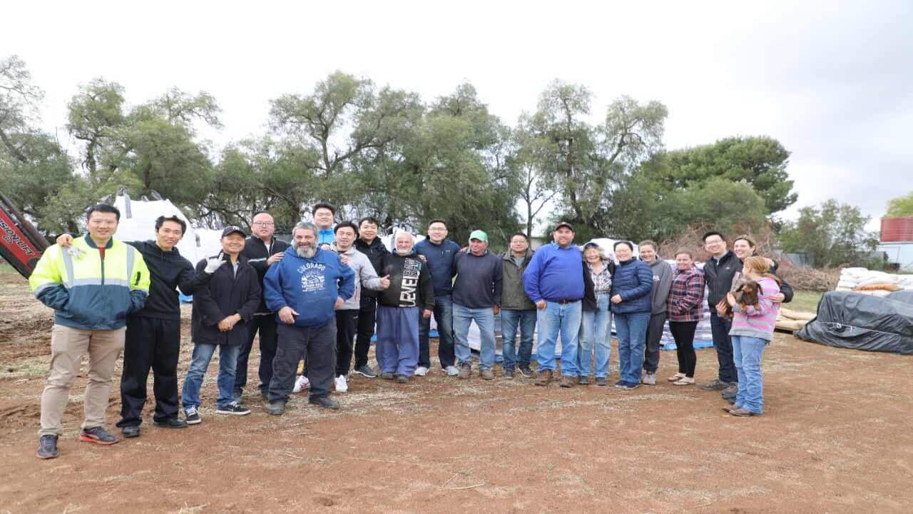 Part of the donation team and the farmers