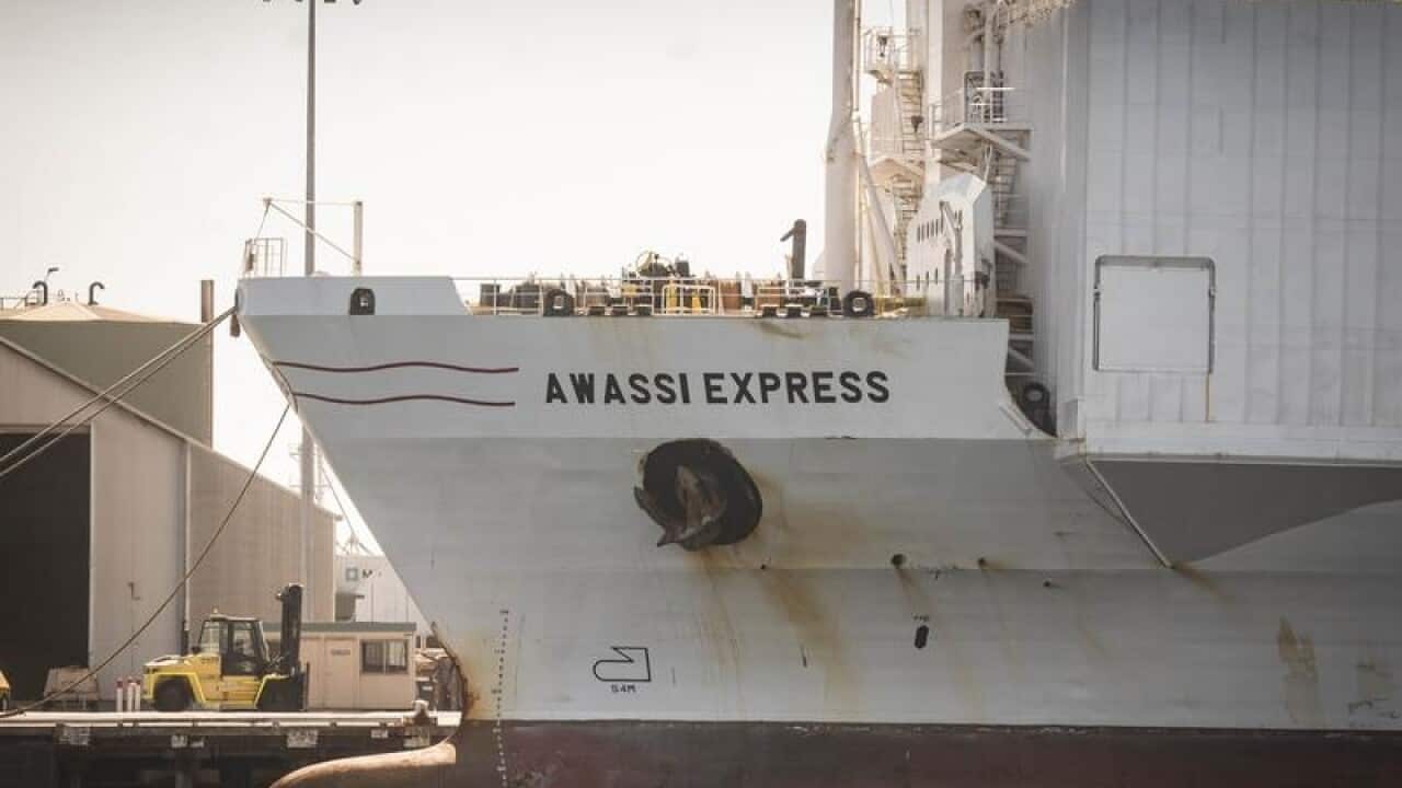 Side view of ship Awassi Express in port