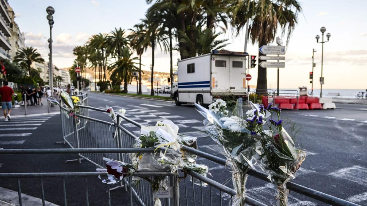 Flowers left on railings in Nice