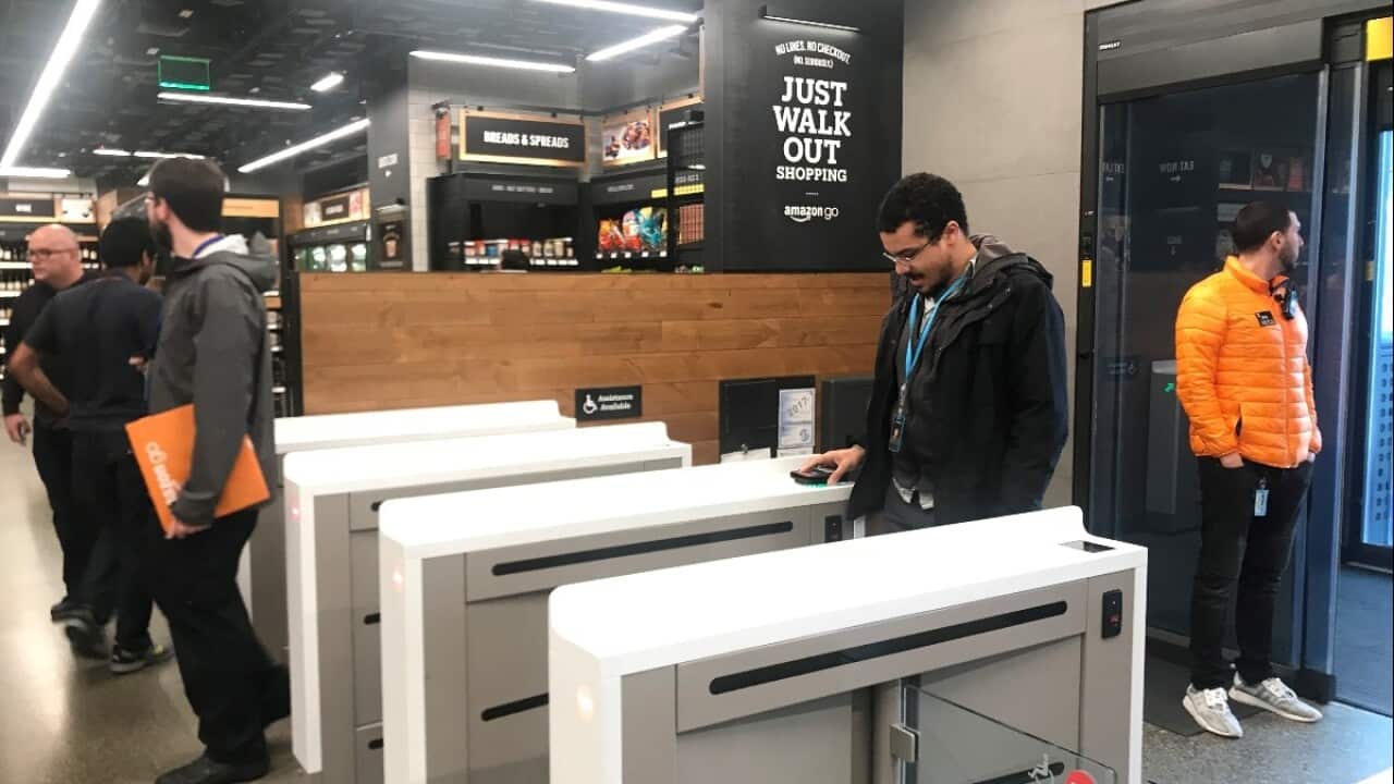 A shopper scans a smartphone app associated with his Amazon account and credit card information to enter the Amazon Go store in Seattle, Washington, U.S., January 18, 2018.