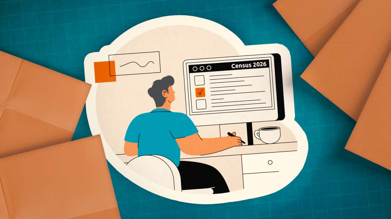 An illustration of a man wearing a blue shirt sitting at a desk, completing the Census on a computer screen. A cup of coffee is next to him, and he is surrounded by pieces of orange paper.