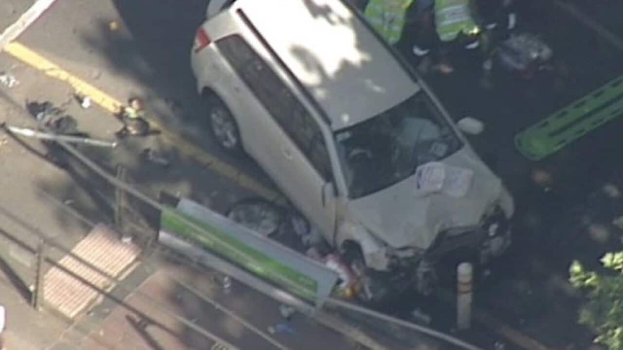 A photo of a crashed car filmed after pedestrians were hit in Melbourne.